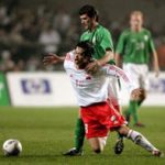 Ireland's Roy Keane tackles Li Yan of China during their international challenge soccer match at Lansdowne Road in Dublin